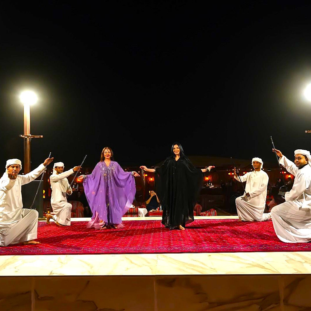 Traditional Emirati dance performance at a desert safari camp
