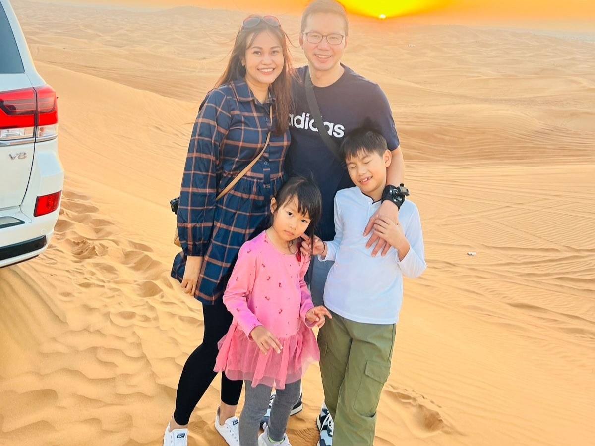 Family with their private Land Cruiser at sunset on the Private Exclusive Safari
